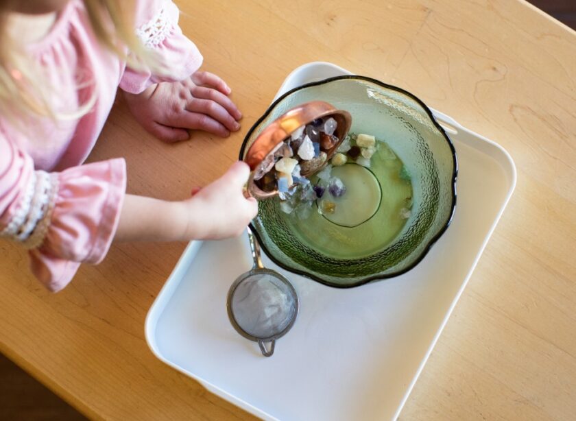 Crystal objects being poured into a bowl.