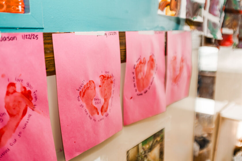 Paintings hanging up in a classroom