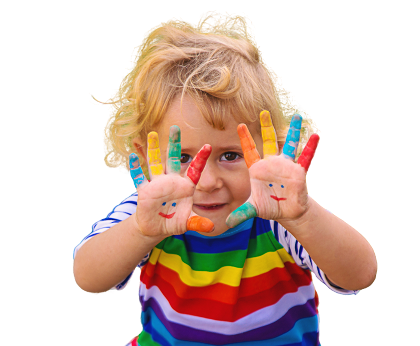 A little boy holding up his hands covered in rainbow paint.